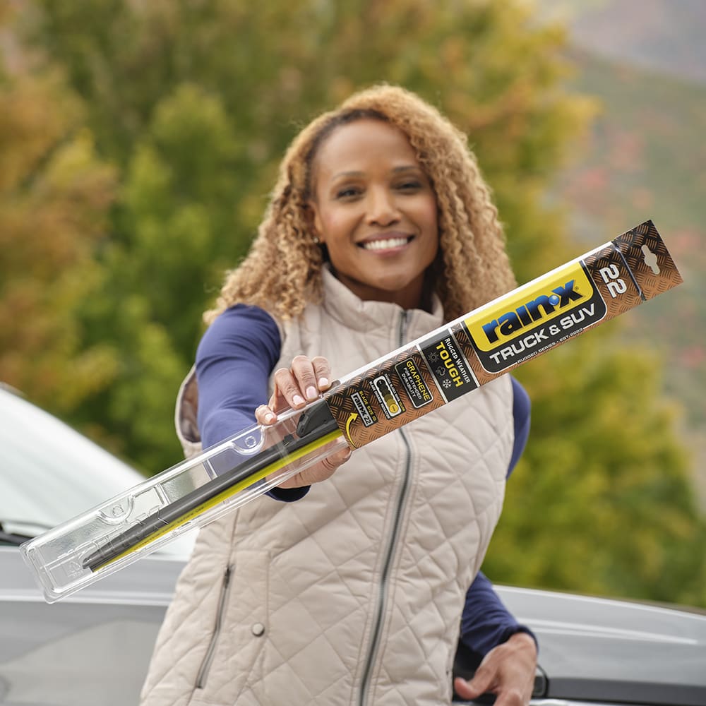 Woman holding Rain-x Truck & SUV V2 Wiper Blade